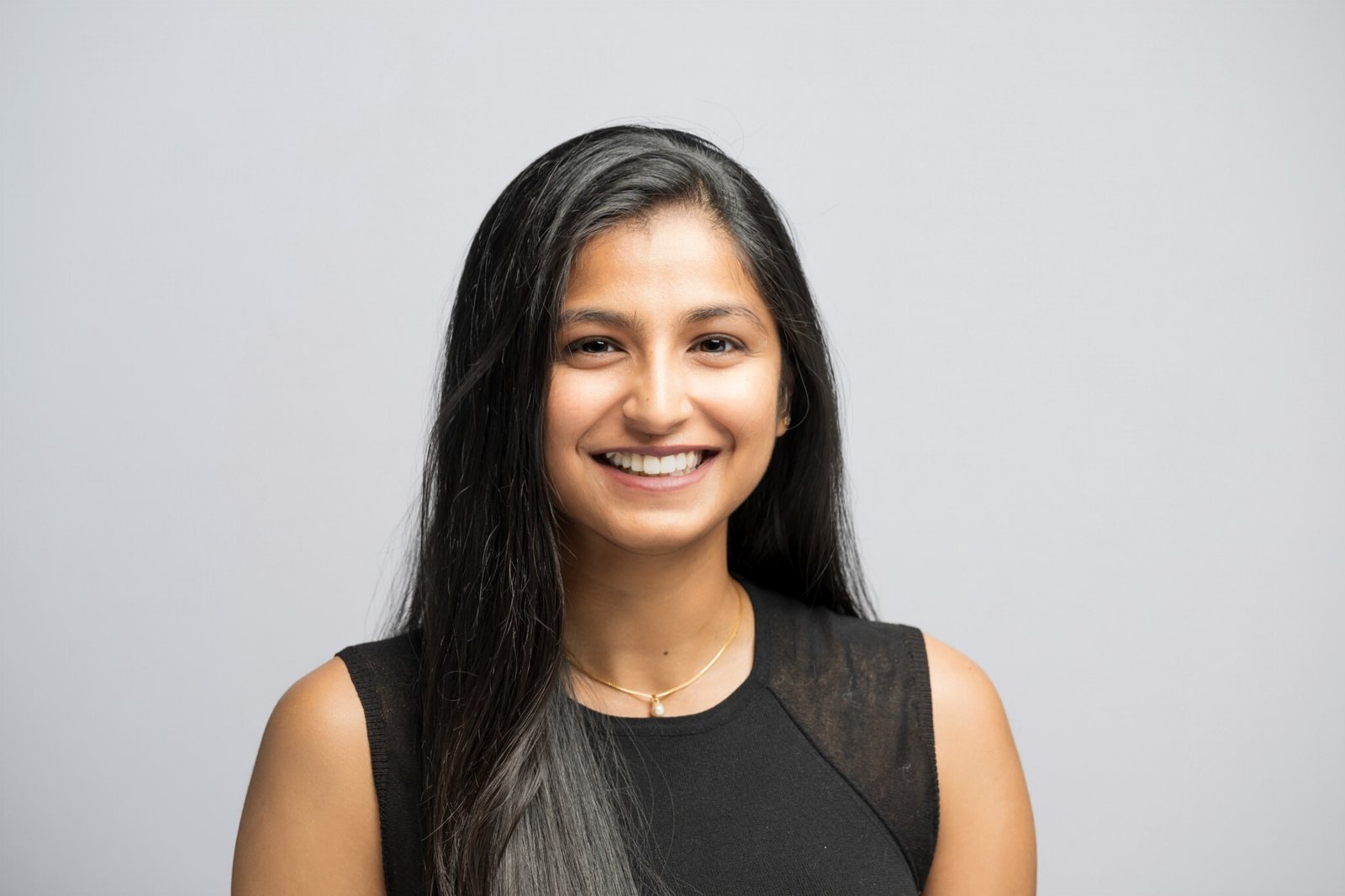 Sloka Akula smiling, ready to chat